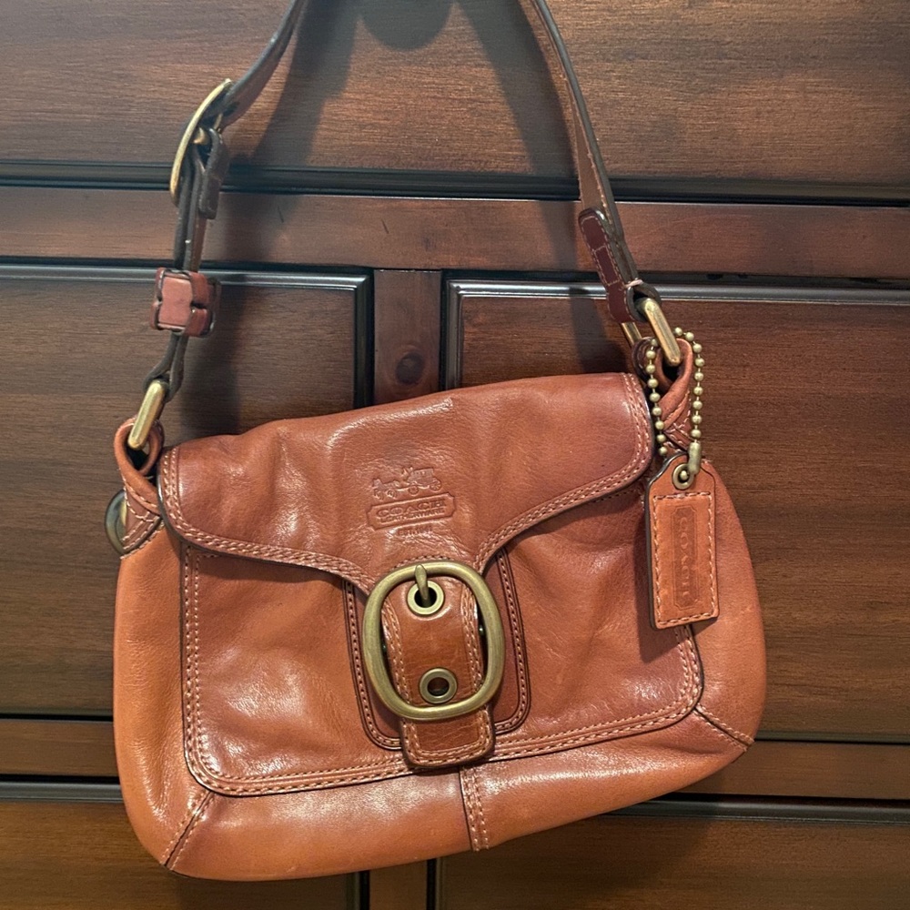 Vintage Coach bag with buckle. Barely used. Perfect for going out.